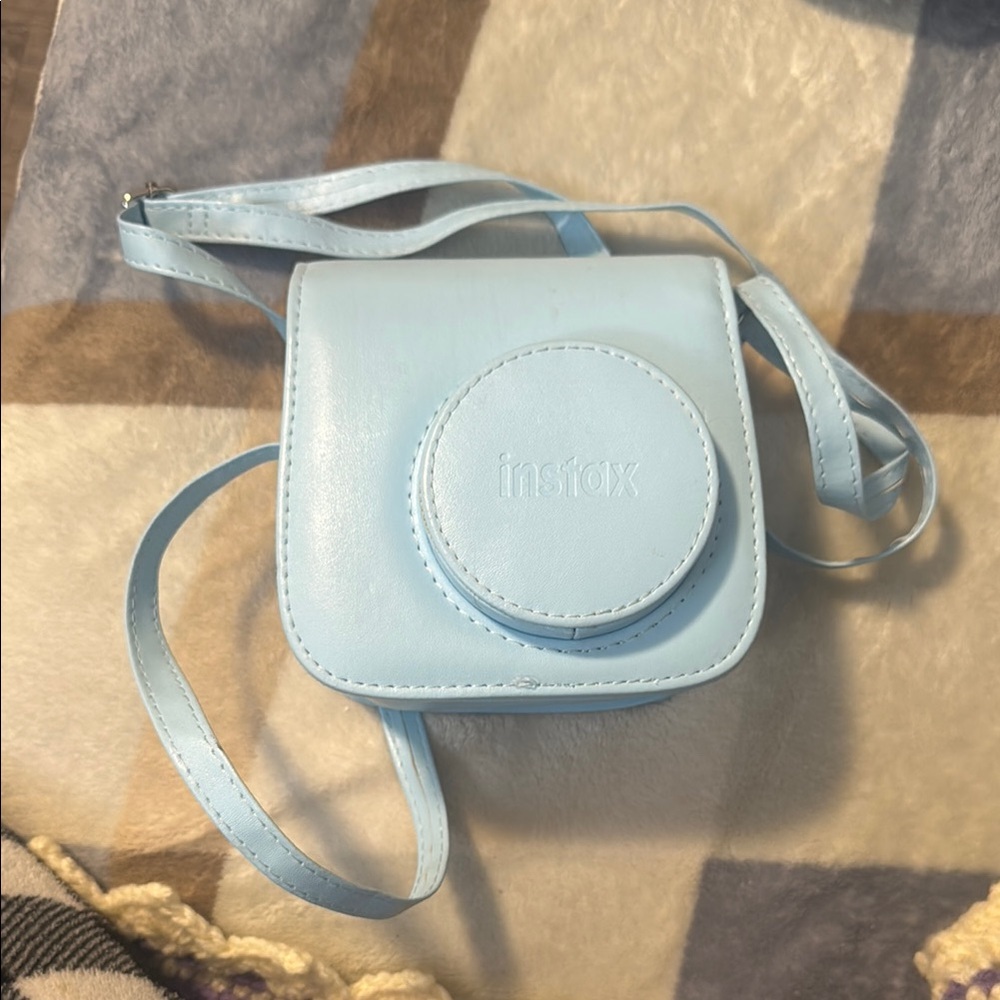 Baby blue Polaroid camera